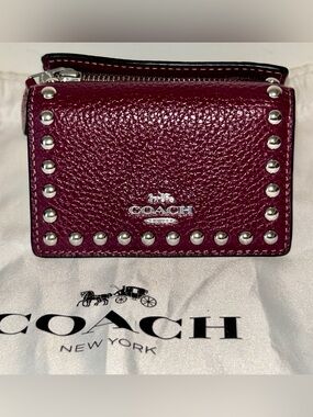 Coach Micro Wallet with Rivets in the shade Deep Berry .  Like New